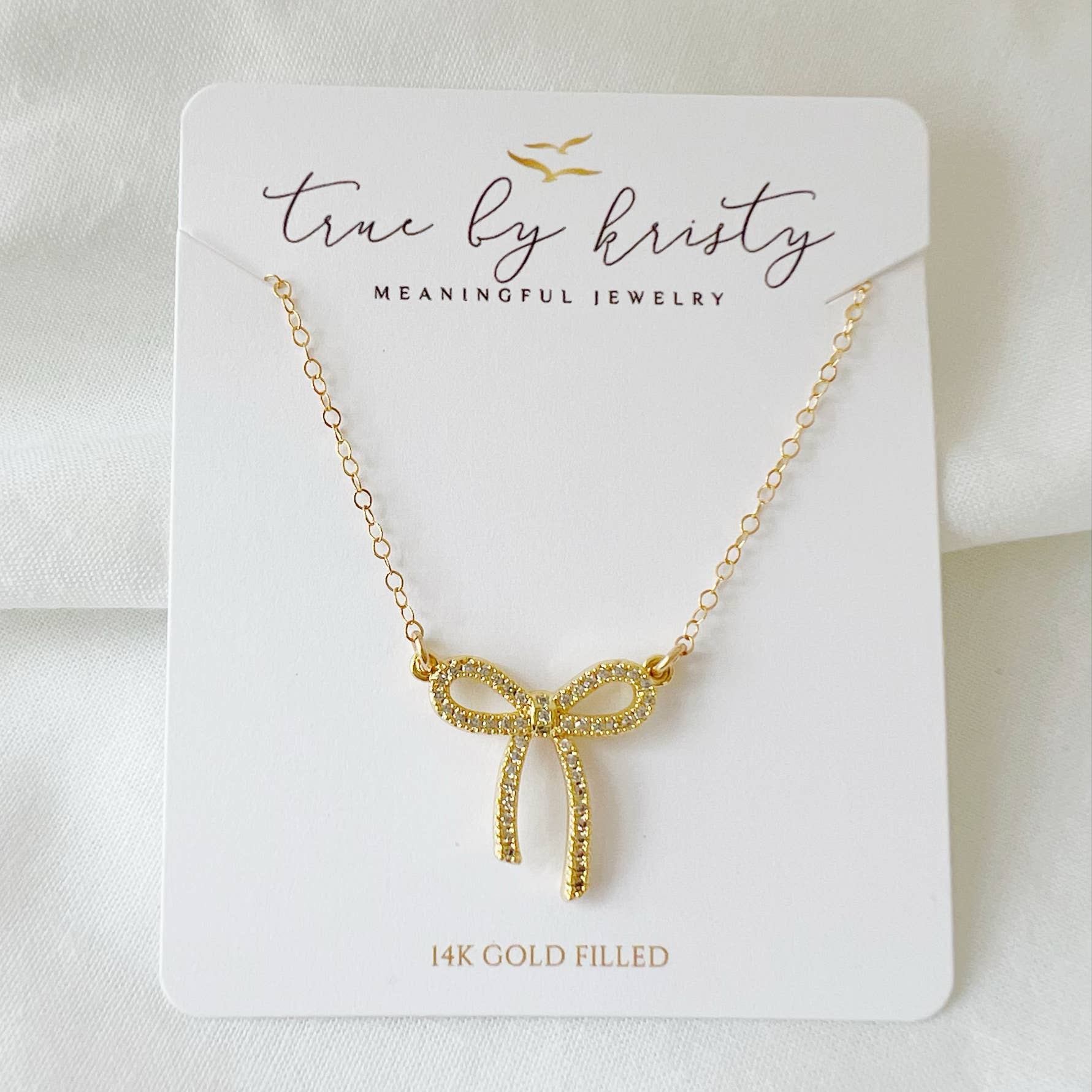 14k Gold Filled Bow Necklace by True by Kristy – CZ Ribbon Pendant