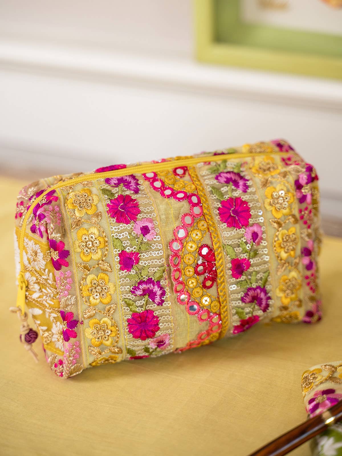 Bel Canto Saffron Magenta makeup bag by April Cornell. Pouch is covered in Lace Ribbon trims are a mix of polyester, rayon, zari & sequin.