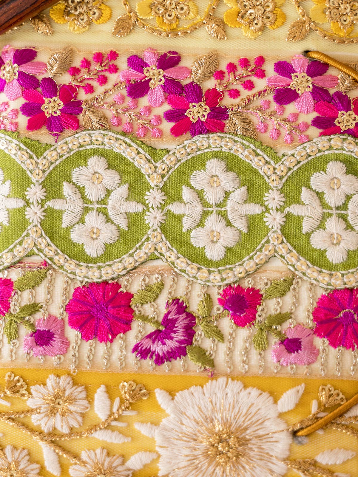 Bel Canto Saffron Magenta covered in Lace Ribbon trims are a mix of polyester, rayon, zari & sequin.