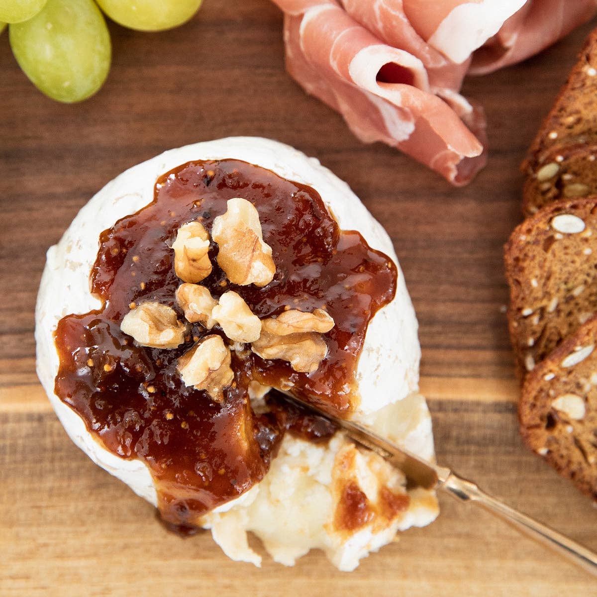 Ball of cheese drizzled with Caramelized Fig Jam with Pear and Honey by Blake Hill Preserves – a gourmet preserve