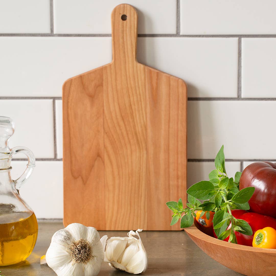 Another view of the Cherry Handled Cheese Board – a beautifully handcrafted piece made from rich cherry wood, featuring a durable handle, by J.K. Adams.