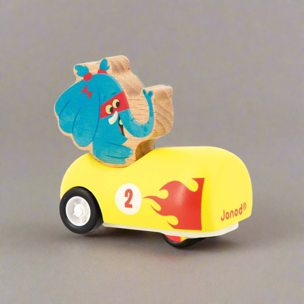 Elephant sitting in a yellow Wooden Pull-Back Car by Janod