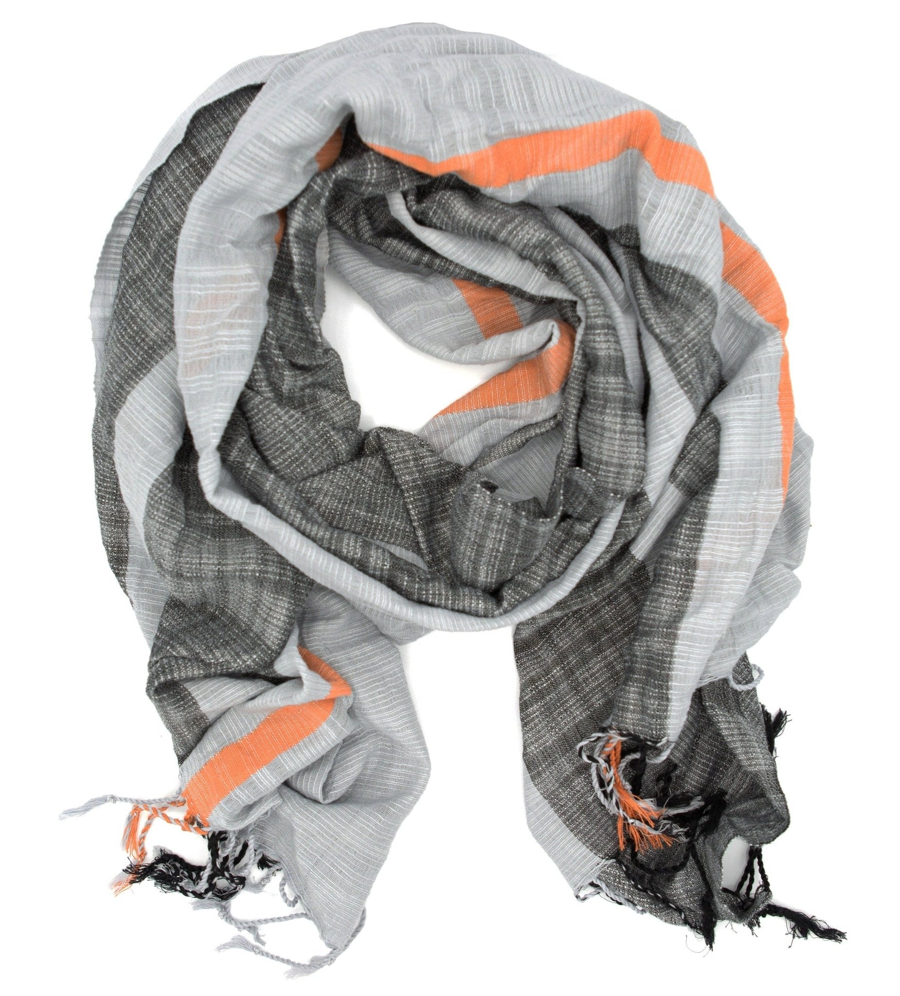 The Graphite Woven Striped Scarf by Fair Anita features gray and orange stripes, finished with playful tassels