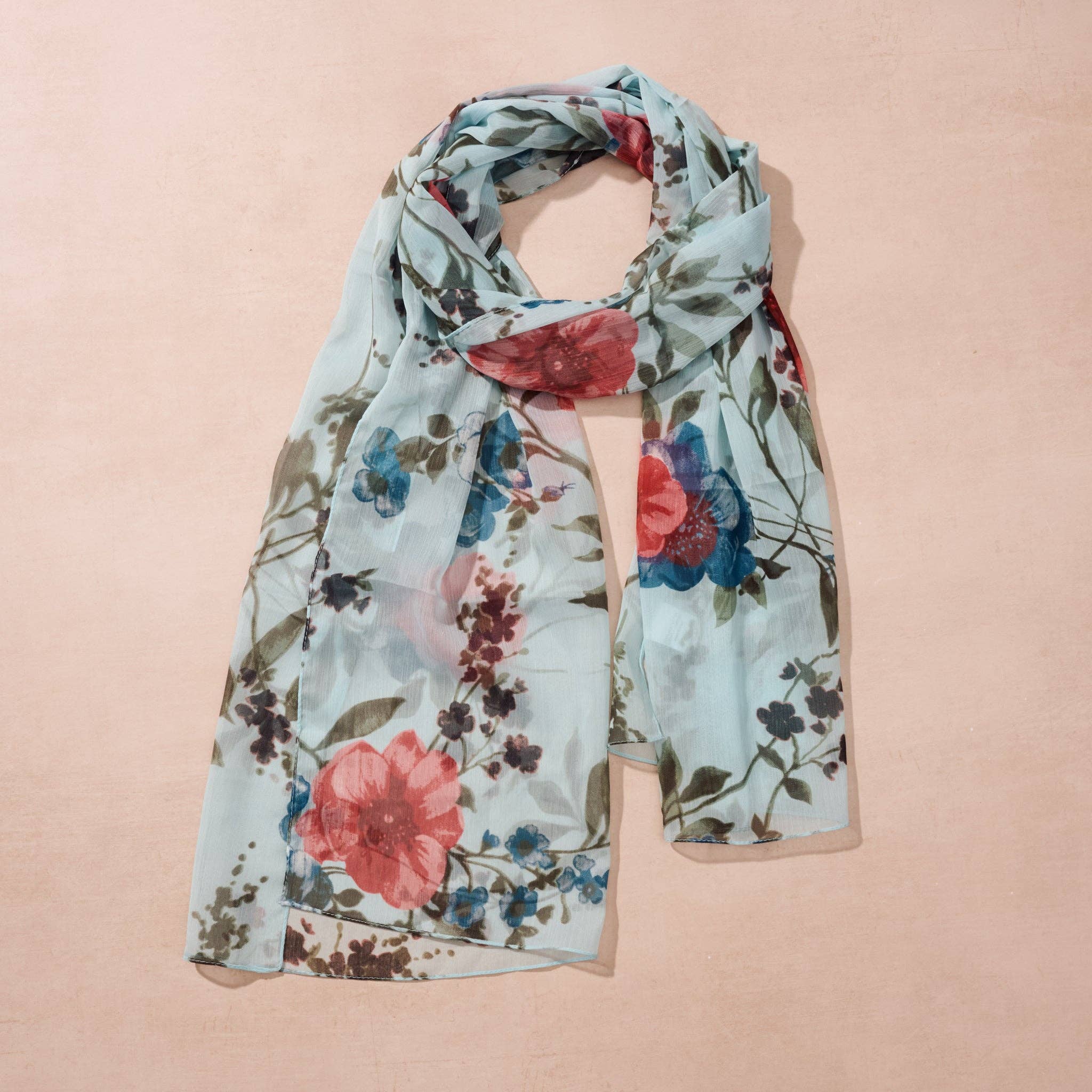 Komal Floral Chiffon Scarf – A lightweight chiffon scarf by Ten Thousand Villages, featuring a delicate blue and peach floral design