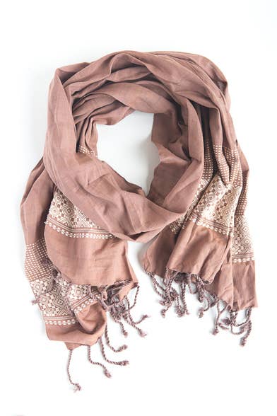 The Mauve Patterned Scarf by Fair Anita features delicate lace detailing for an elegant touch.