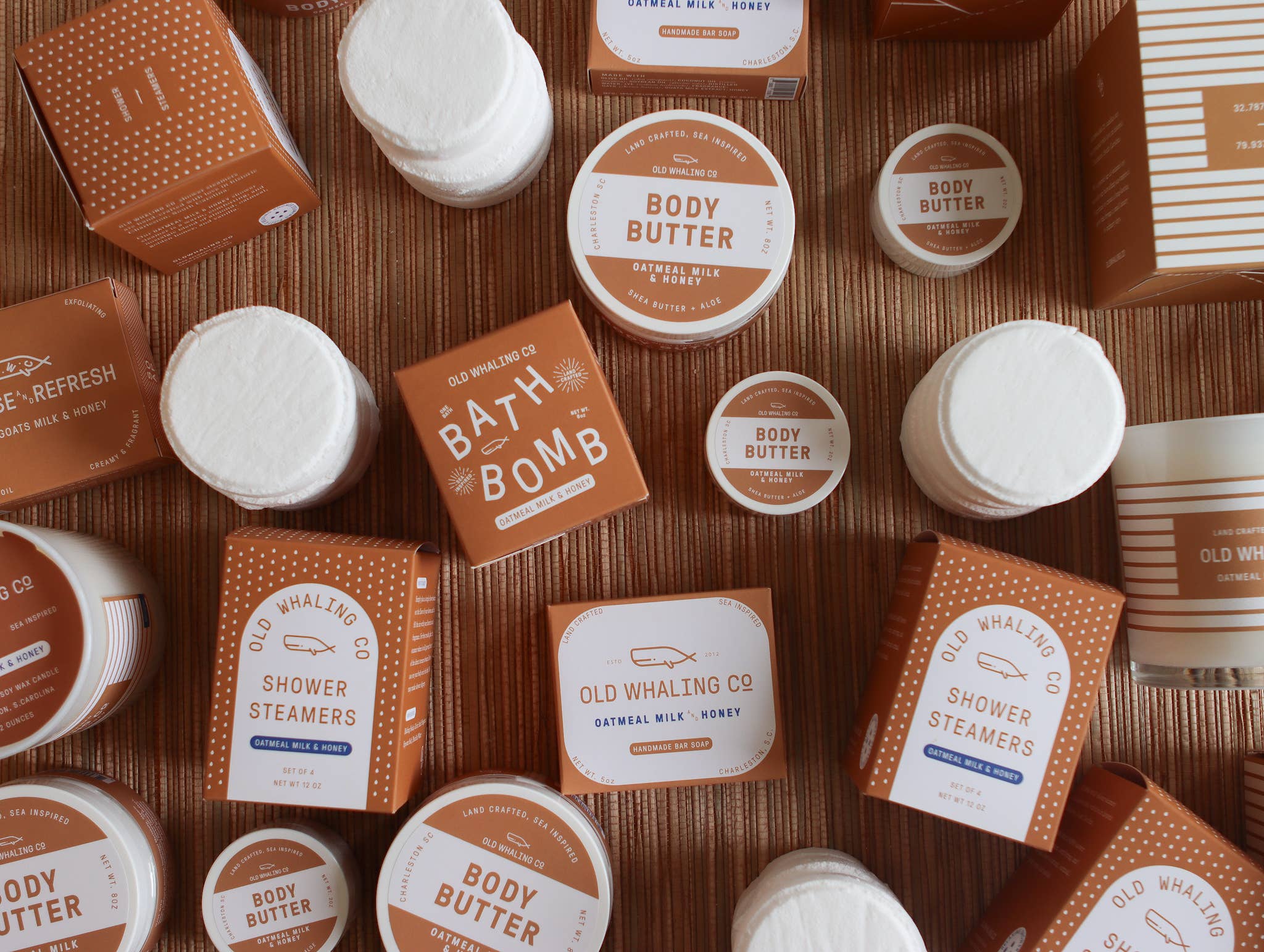 Oatmeal Milk & Honey 2oz travel size body butter by Old Whaling Co surrounded with other Oatmeal Milk & Honey products