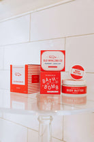 Seaberry 8oz body butter by Old Whaling Co surrounded with other Seaberry products