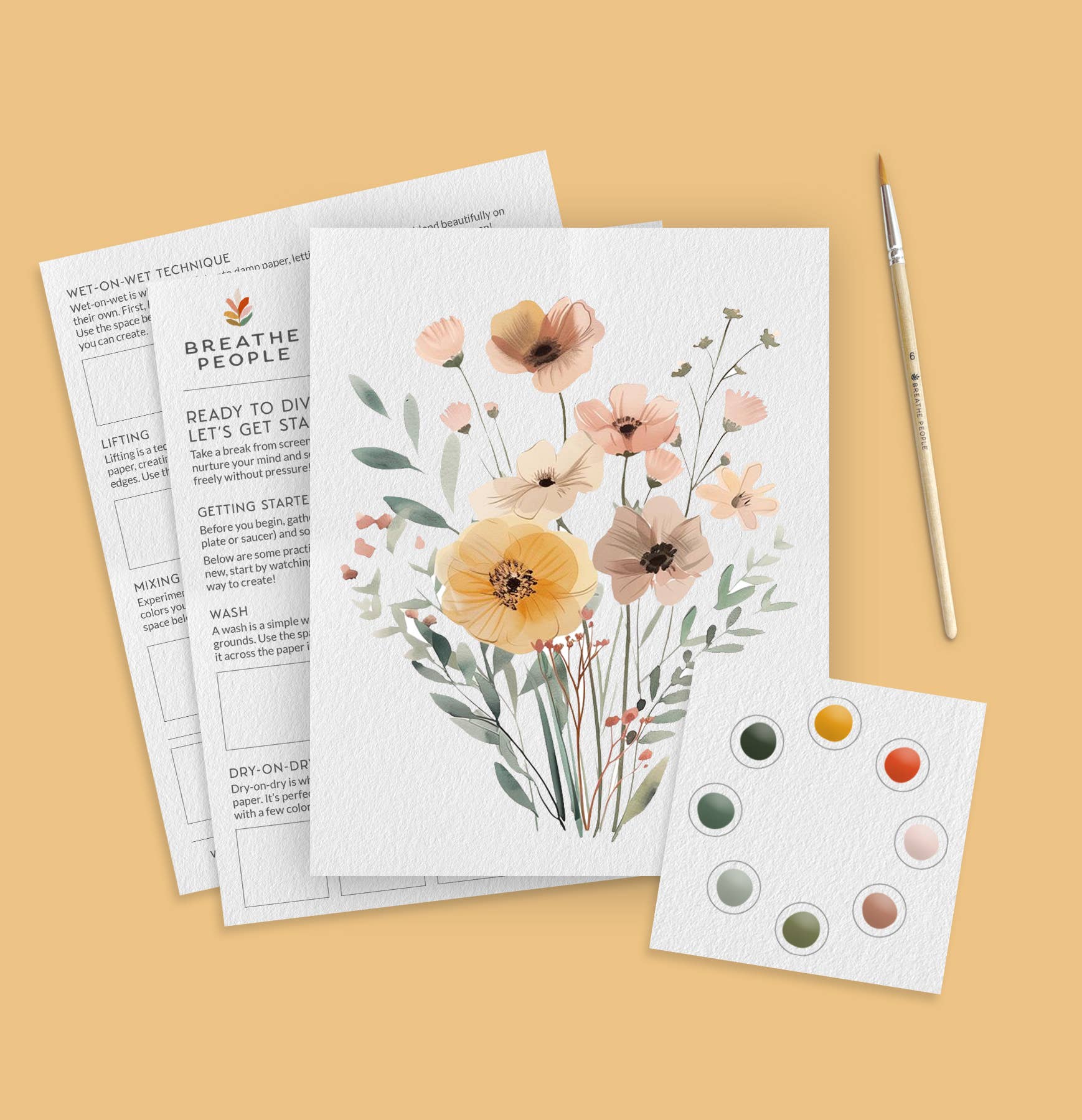 Wildflowers Watercolor Kit by Breathe People, accompanied by a paintbrush and color swatch on a beige background.