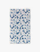 Blue Floral Luxe Hand Towel by Geometry. Towel has a blue floral print on a white background.