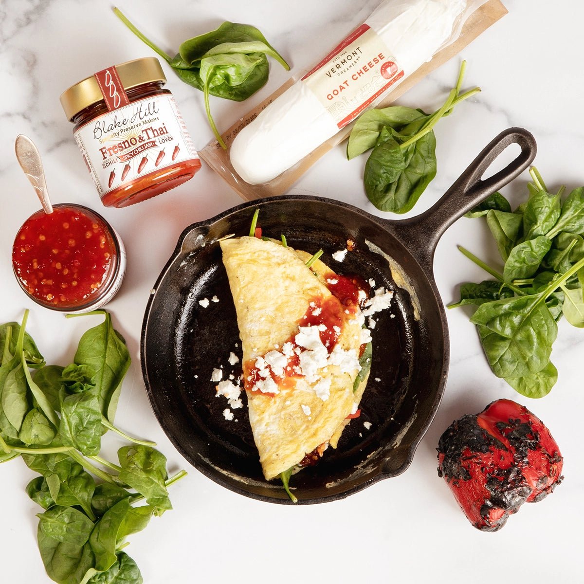 Omelette topped with Blake Hill Preserves Fresno & Thai Spicy Chili jam.