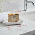 Kind Apothecary Bulgarian Rose Natural Artisan Soap Bar being used in a bathroom setting 