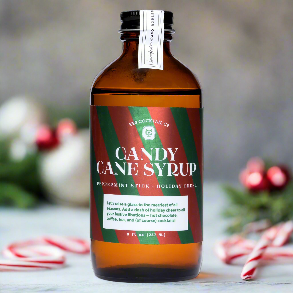 Candy Cane Syrup bottle with holiday backdrop 