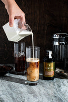 Milk being poured into Cold Brew Coffee Syrup