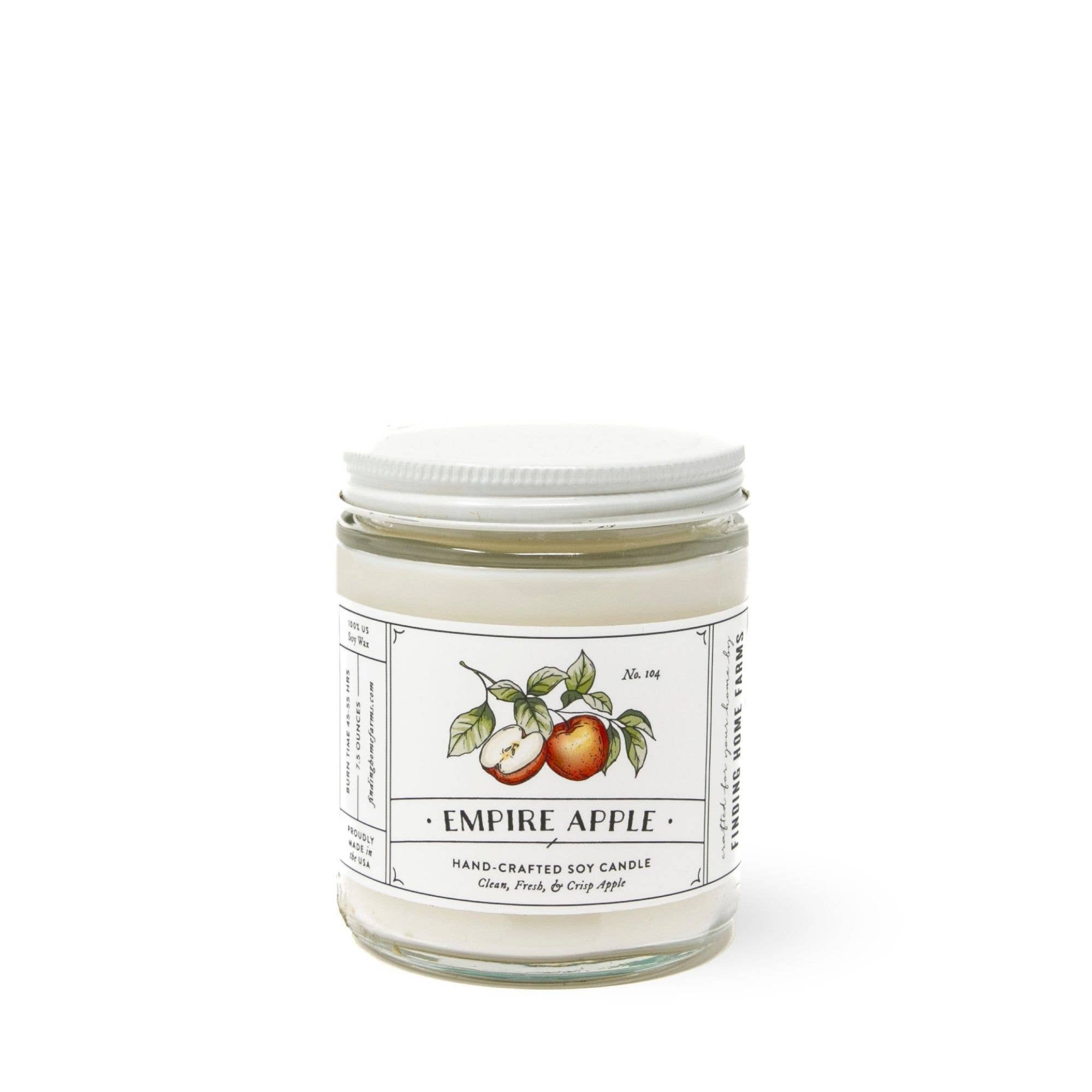 Jar of Empire Apple Soy Candle  by FInding Home Farms with a white label on a white background