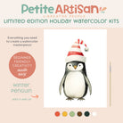 Kids Penguin Holiday Watercolor Kit by Breathe People, featuring a holiday watercolor kit with a penguin wearing a Santa hat on a beige background.