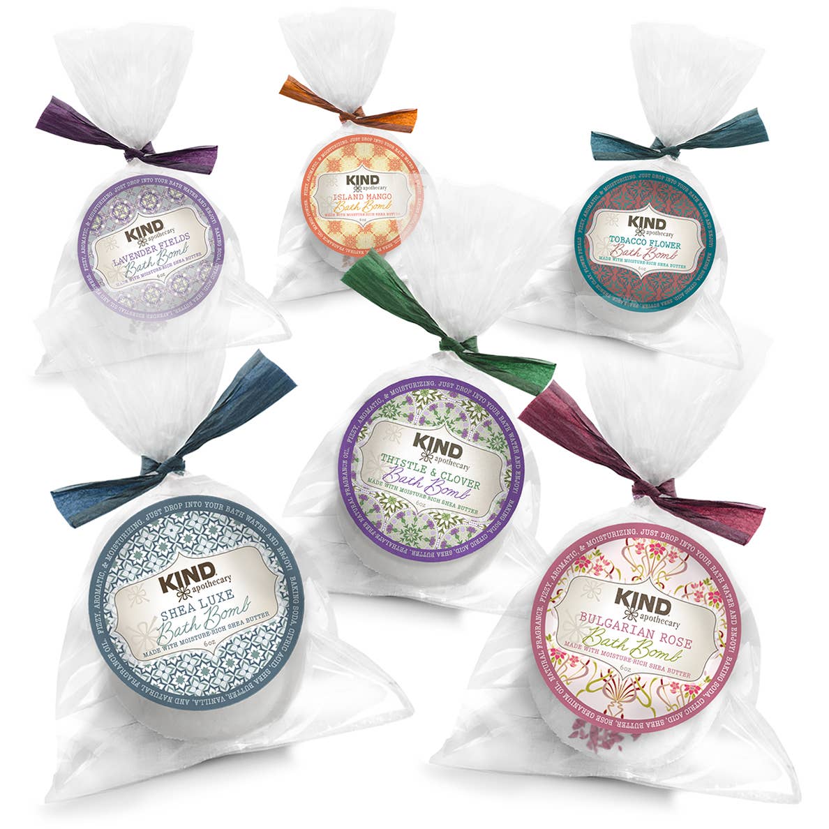 Assorted natural bath bombs with shea butter wrapped in a clear plastic bag tied with a matching color bow