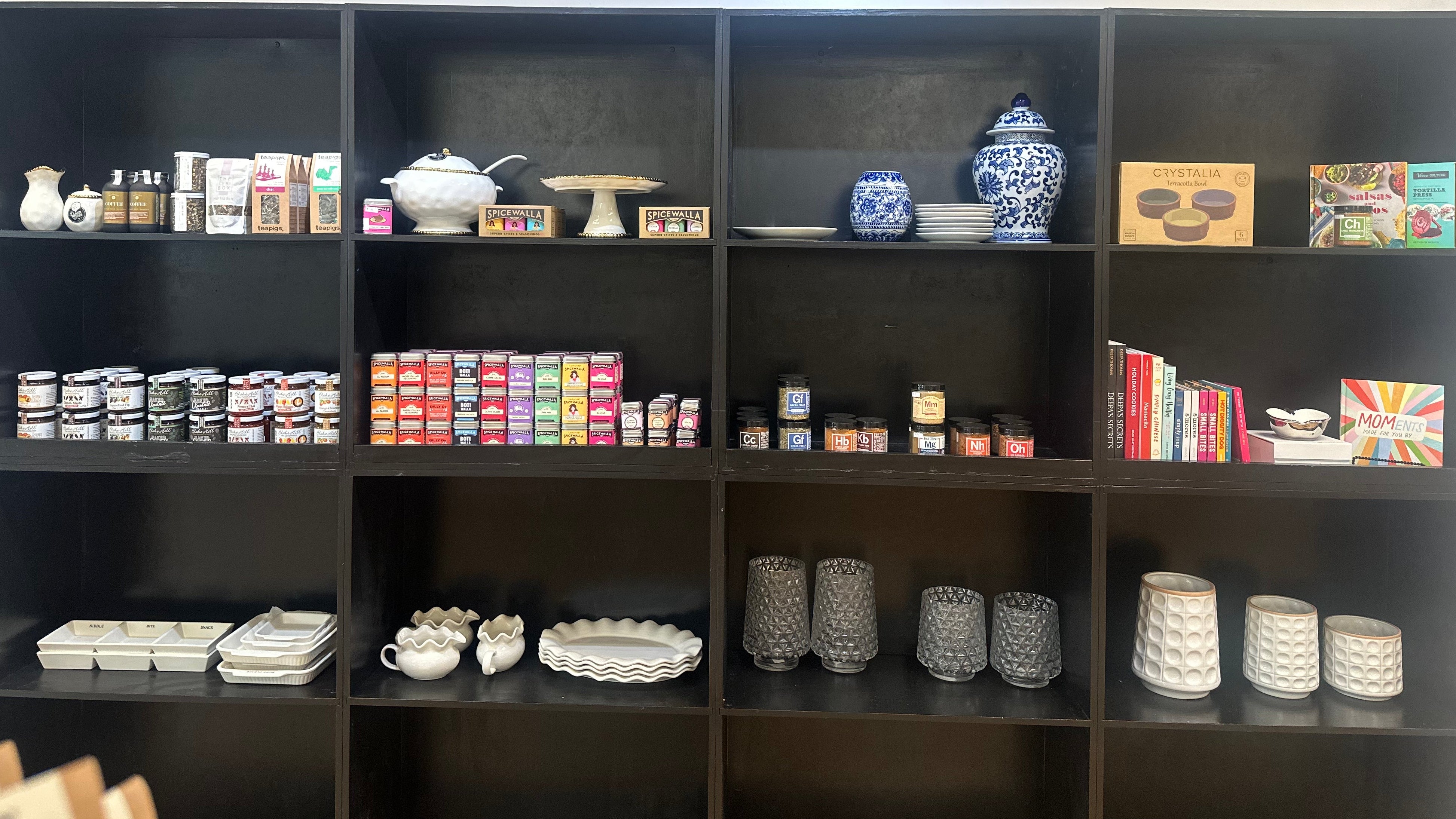 Curated gourmet food and gifts displayed on boutique shelves in Corning NY