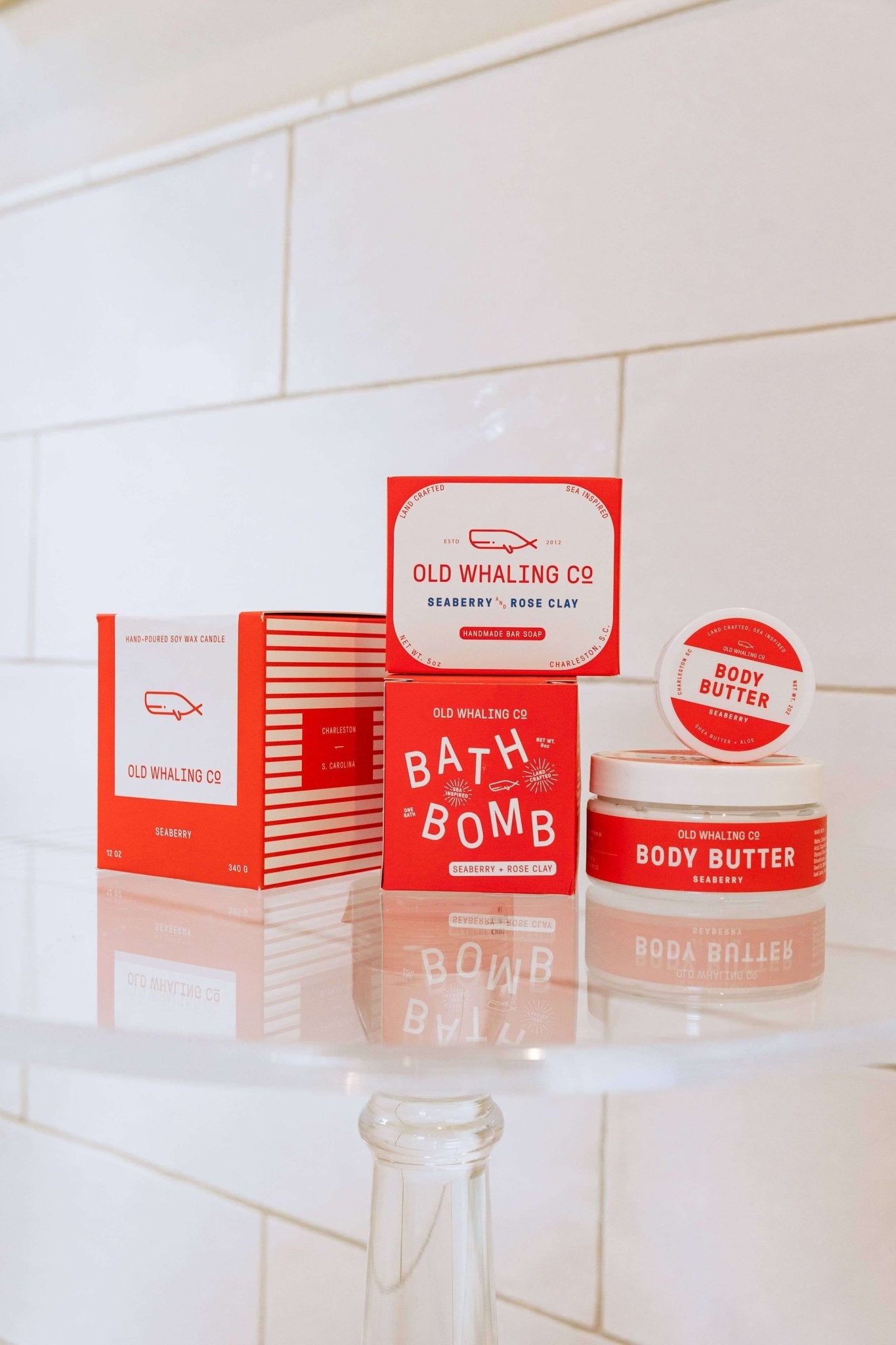 Seaberry 8oz body butter by Old Whaling Co surrounded with other Seaberry products