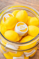 Close-up of Seaside Citrine 2oz travel size body butter by Old Whaling Co in a plastic jar