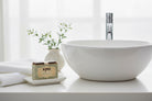 Kind Apothecary TShea Luxe Natural Artisan Soap Bar being used in a bathroom setting 