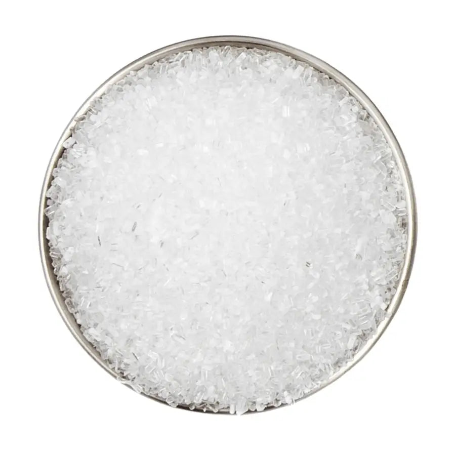 Round ceramic plate with cllose-up of the Sleep Well Bath Soak Lavender Scent Epsom salt bath soak crystals