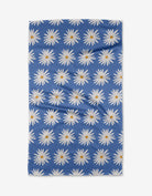 Blue Daisies Tea Towel by Geometry. Tea Towel has a white daisies on a blue background.