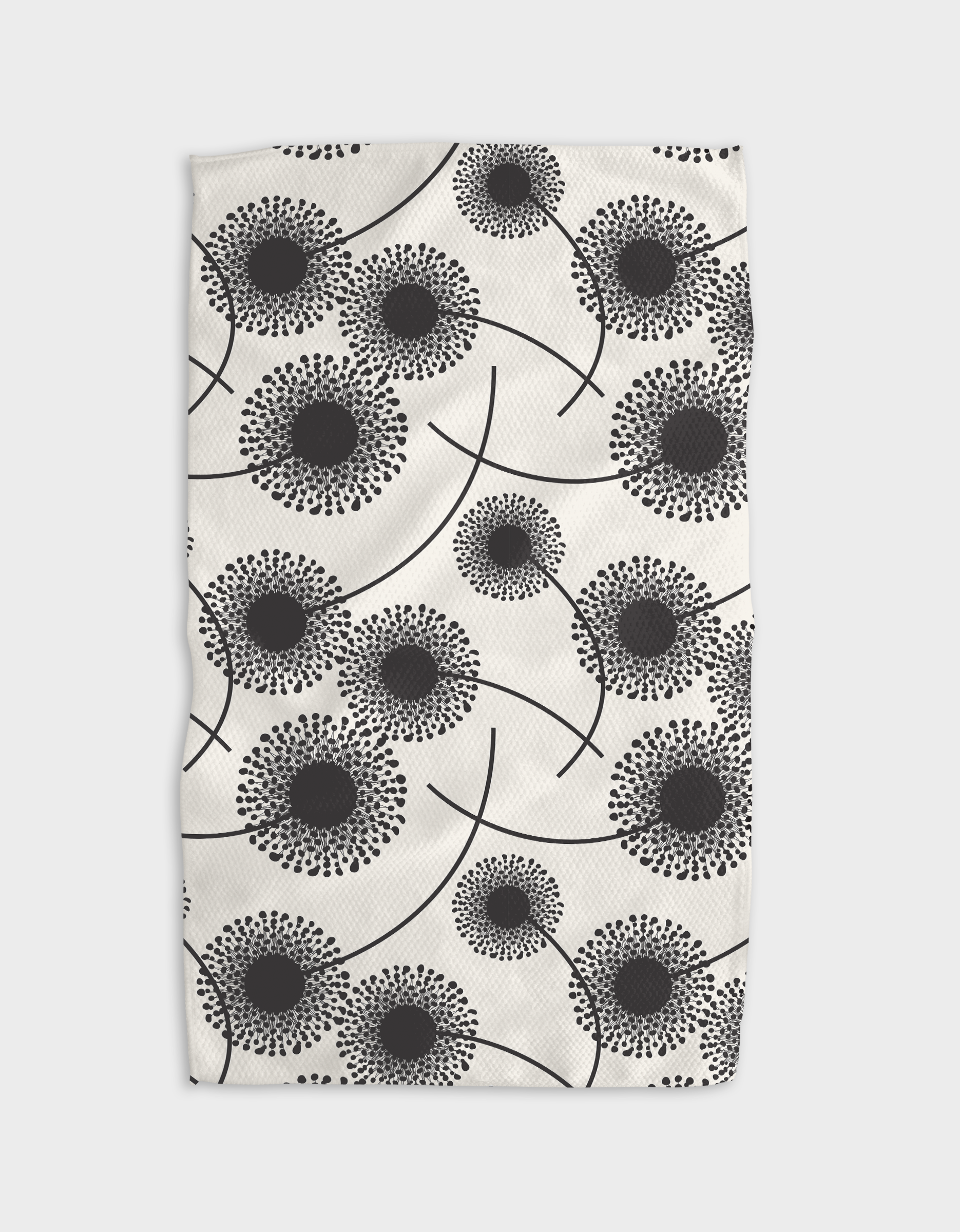 Fully Bloomed Tea Towel by Geometry. Tea Towel has black flowers on a white background.