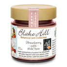 Blake Hill Preserves Strawberry with Wild Rose jam in a glass jar.