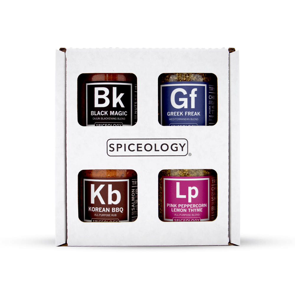 The Veggie Lovers Variety Pack from Spiceology contains 4 spices: Black Magic, Greek Freak Mediterranean Rub, Korean BBQ All-Purpose Rub, and Pink Peppercorn Lemon Thyme in glass jars. 